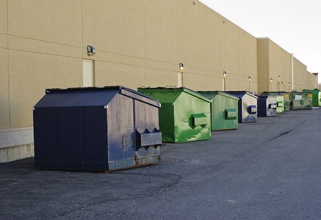 a yellow construction dumpster on a work site in Ferguson